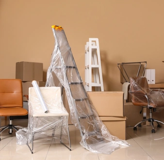 Office furniture and equipment prepared for commercial moving services by City of Angels Move